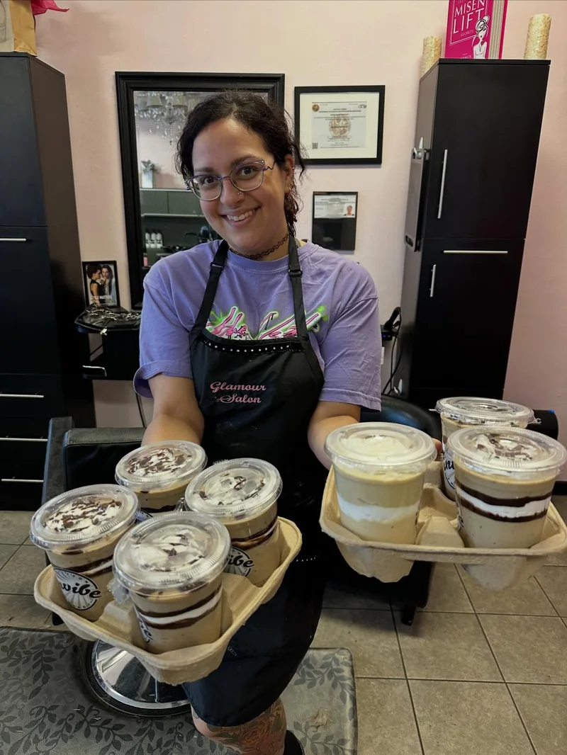 A person at the salon holding trays of InVibe cups in March 2026