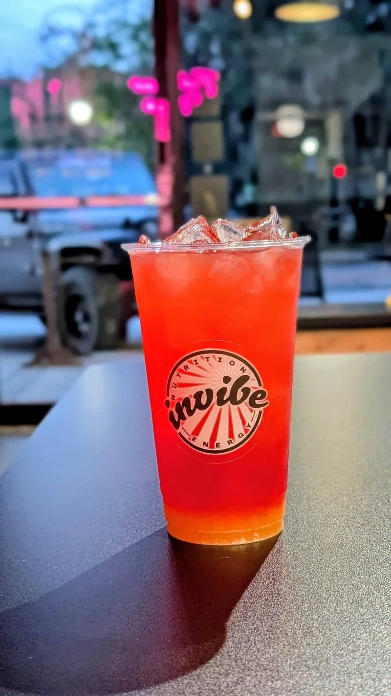 A red and orange InVibe tea by the club window